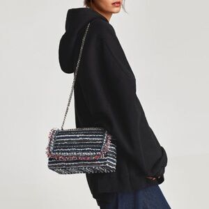 Zara, Multicoloured woven crossbody bag. Pearl and frayed detail on the flap.